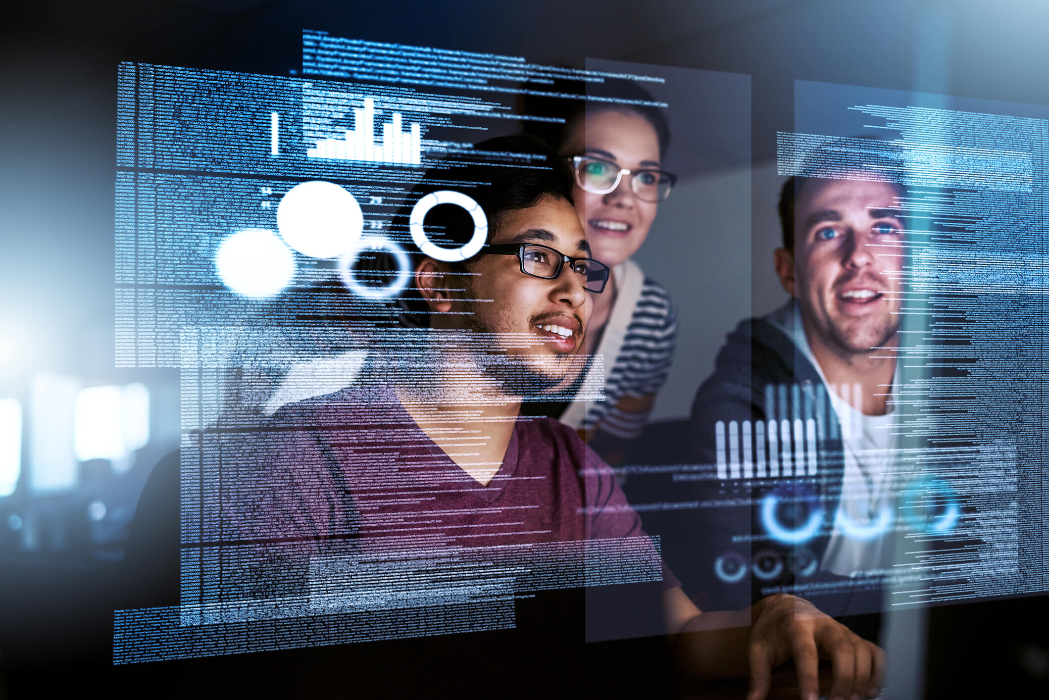 Three cybersecurity professionals viewing data on a floating virtual screen