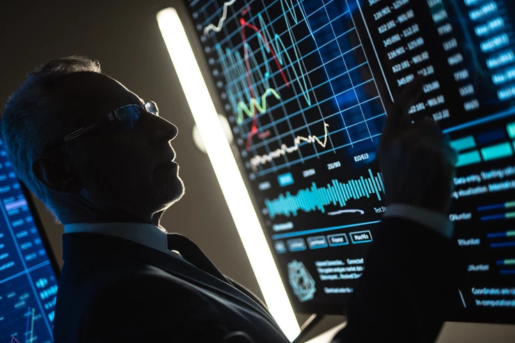 man-working-on-large-computer-screen